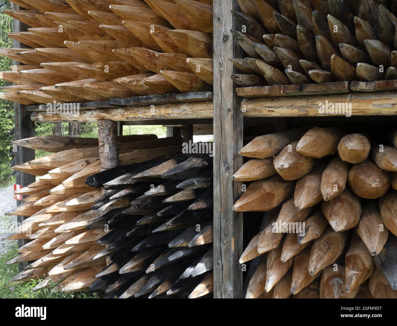 Pointed wood logs pattern inside hut Stock Photo - Alamy