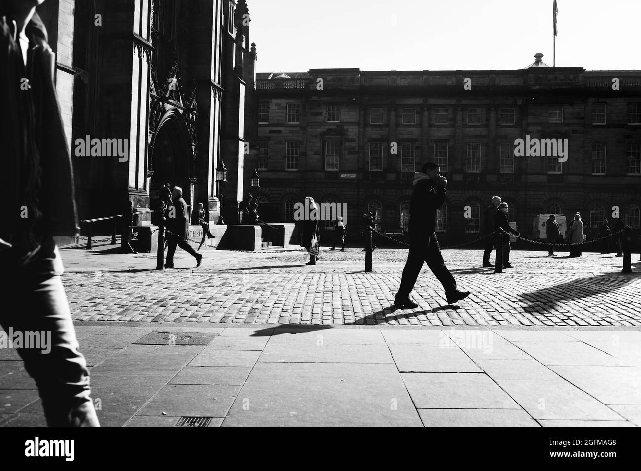 People walking around Parliament Square of Edinburgh Stock Photo