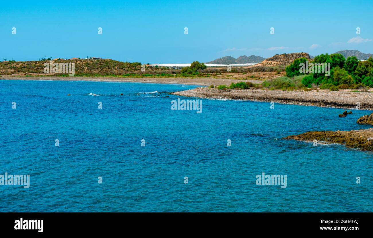 a view over the lonely Playa del Rafal beach, in Aguilas, in the Costa Calida coast, Region of Murcia, Spain Stock Photo