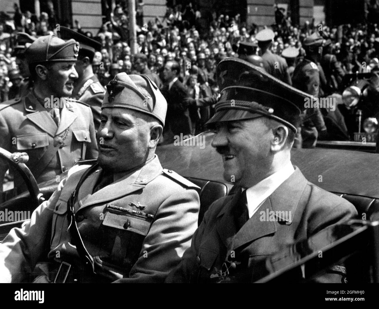 Hitler and Mussolini riding together in a car in Munich in. 1940 Stock Photo