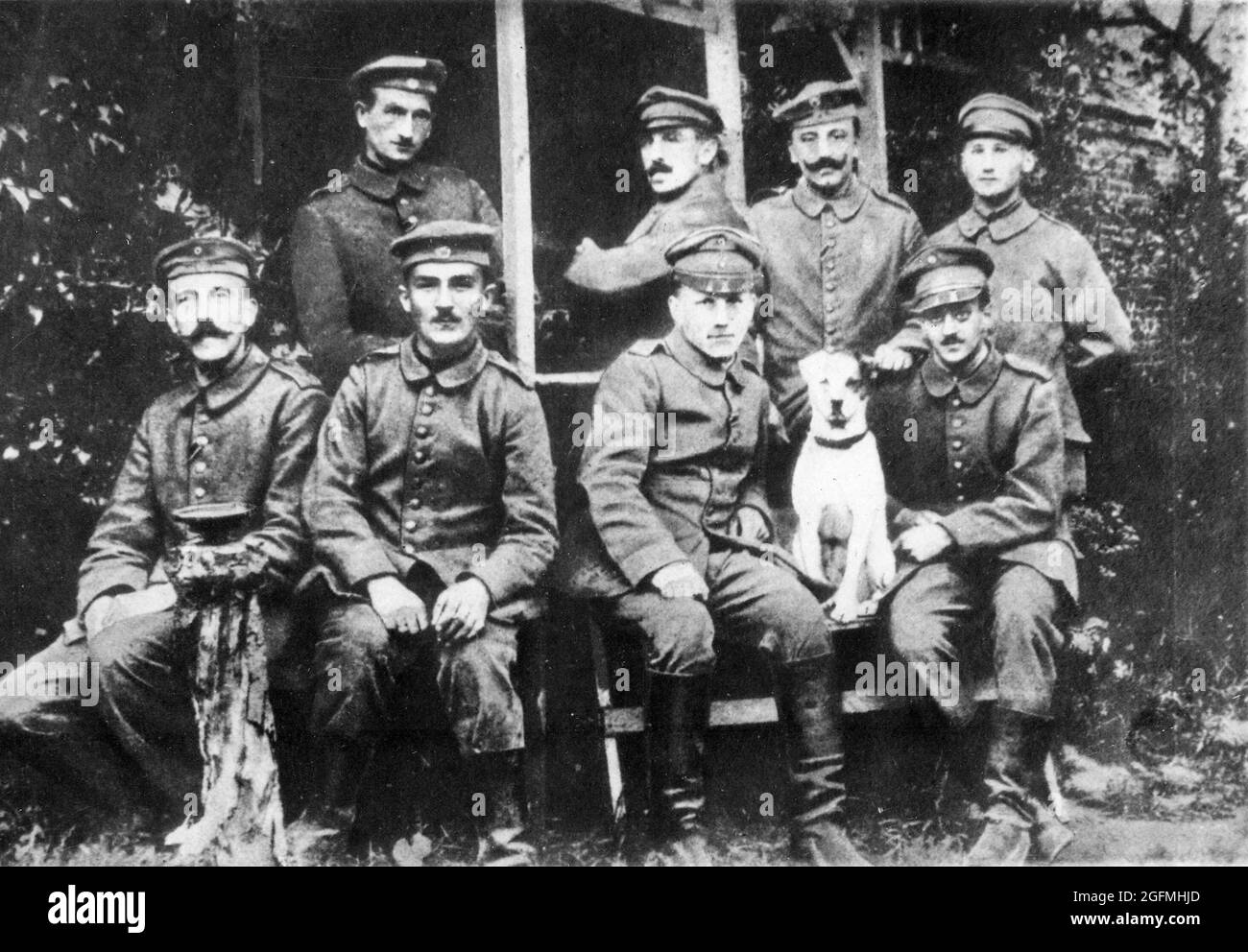 Hitler (far left with moustache) with his fellow soldiers during WW1. The dog is his Jack Russell called Fuchsl. Stock Photo