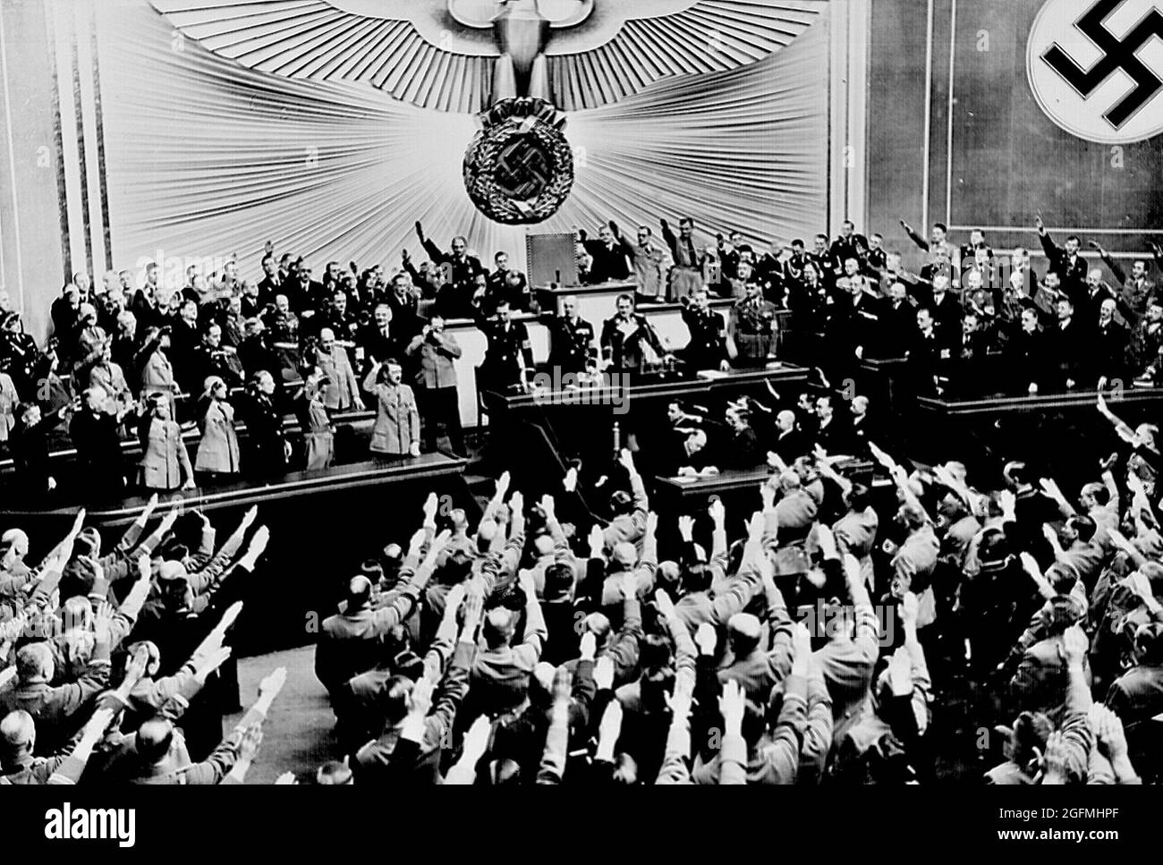 Hitler accepts the ovation of the Reichstag after announcing the 'peaceful' acquisition of Austria. From the U.S. National Archives and Records materials: Stock Photo