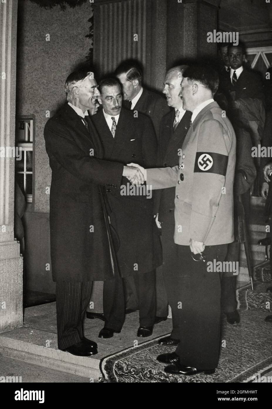 Adolf Hitler and Neville Chamberlain shaking hands at the Munish Agreement in September 1938 Stock Photo
