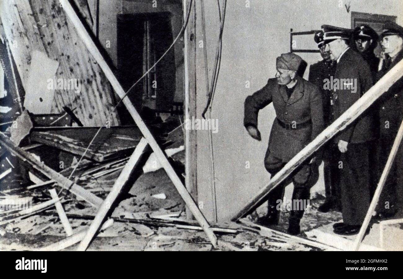 Hitler showing Mussolini the damaged room in his HQ Wolfsschanze near Rastenburg in East Prussia after the attempt on his life on 20 July 1944. (from left to right: Benito Mussolini, unknown, Adolf Hitler, unknown, Joachim von Ribbentrop) Stock Photo