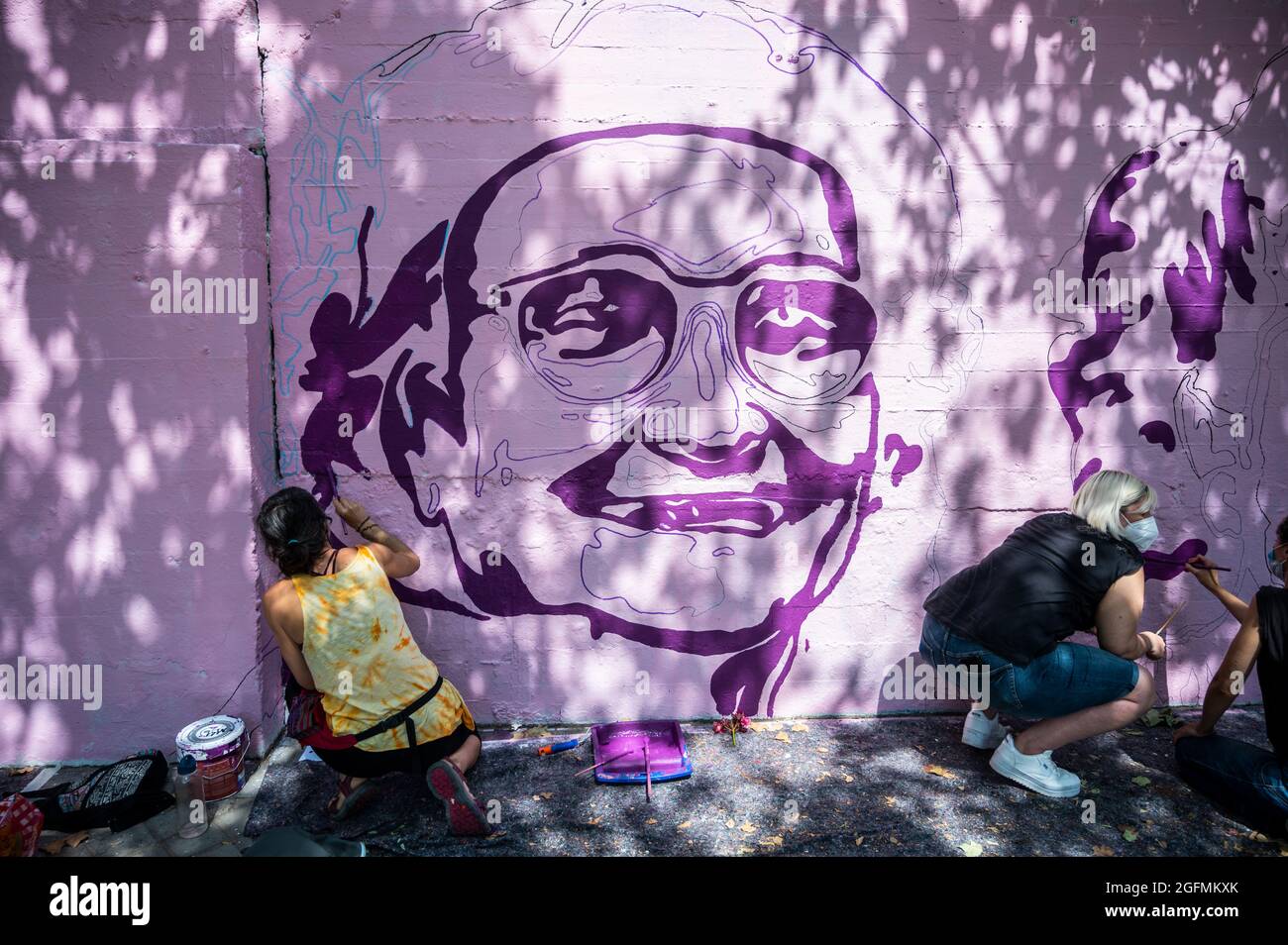 Madrid, Spain, 26/08/2021, Madrid, Spain. 26th Aug, 2021. Members of UNLOGIC artistic group repainting a feminist mural that appeared vandalized during the past International Women's Day. The mural represents famous women from around the world, with the faces of 15 women who are part of history for their fight in favor of equality: Angela Davis, Frida Kahlo, Nina Simone, Rigoberta Menchu, Lucia Sanchez Saornil, Rosa Arauzo, Valentina Tereshkova, Chimamanda Ngozi, Emma Goldman, Kanno Sugato, Liudmila Pavlichenko, Billy Jean King, Gata Cattana, Rosa Parks, and Comandanta Ramona. Credit: Marcos d Stock Photo