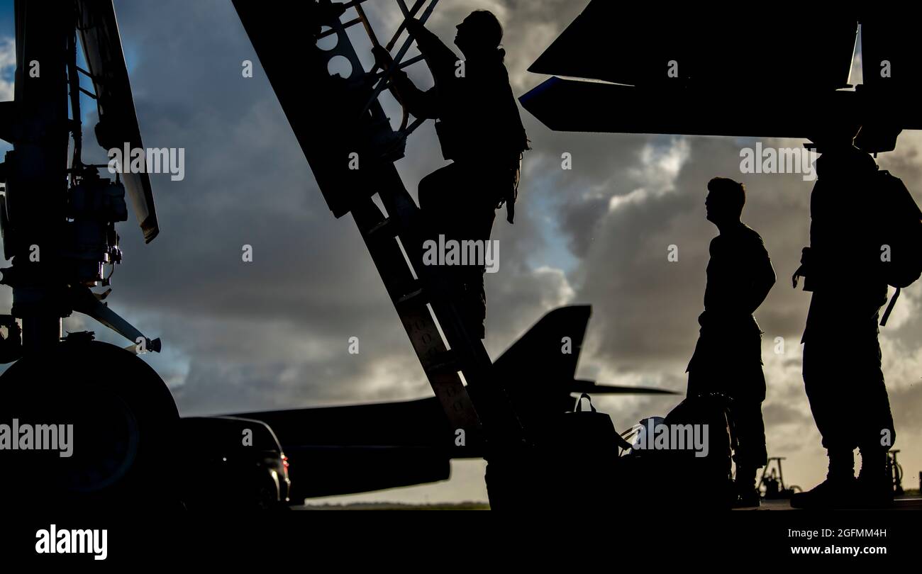 Capt. “HARM,” 9th Expeditionary Bomb Squadron B-1B Lancer weapons system officer instructor, climbs out of a B-1B at Andersen Air Force Base, Guam, May 22, 2020. This B-1B aircrew completed a 24-hour mission that included a large force exercise. The 9th EBS is deployed to Andersen Air Force Base, Guam, as part of a Bomber Task Force supporting Pacific Air Forces’ strategic deterrence missions and  commitment to the security and stability of the Indo-Pacific region.(U.S. Air Force photo by Senior Airman River Bruce) Stock Photo