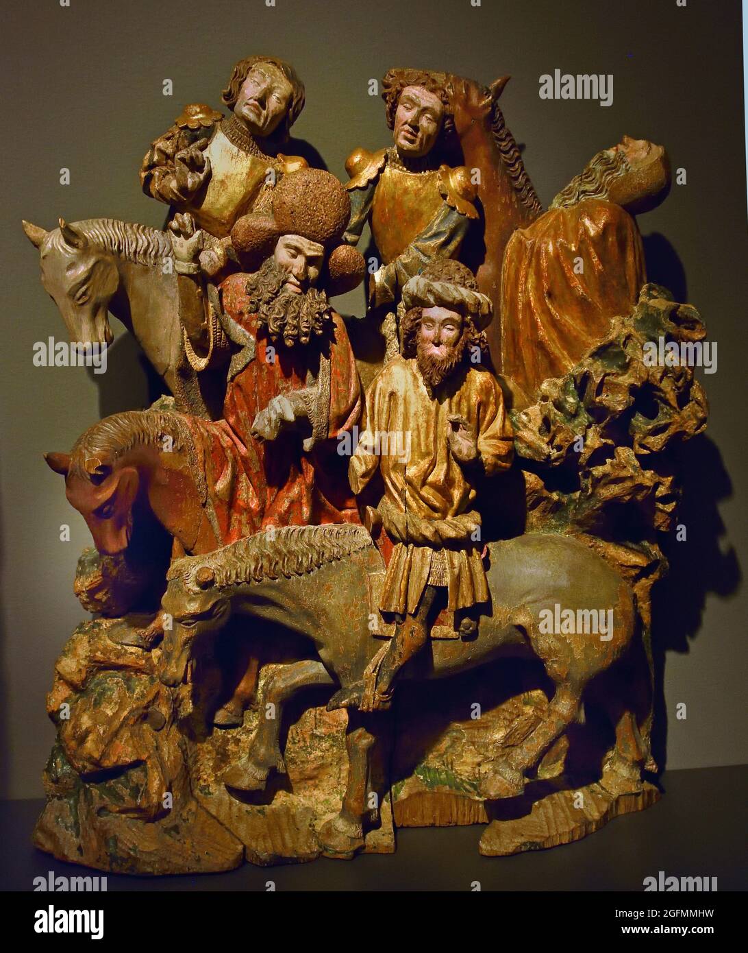 Two groups of horsemen from a Crucifixion scene, anonymous,1435 Brabant, Dutch, The Netherlands. (Oak with polychromy, gilding, leather, glass and metal, 57cm ) Stock Photo