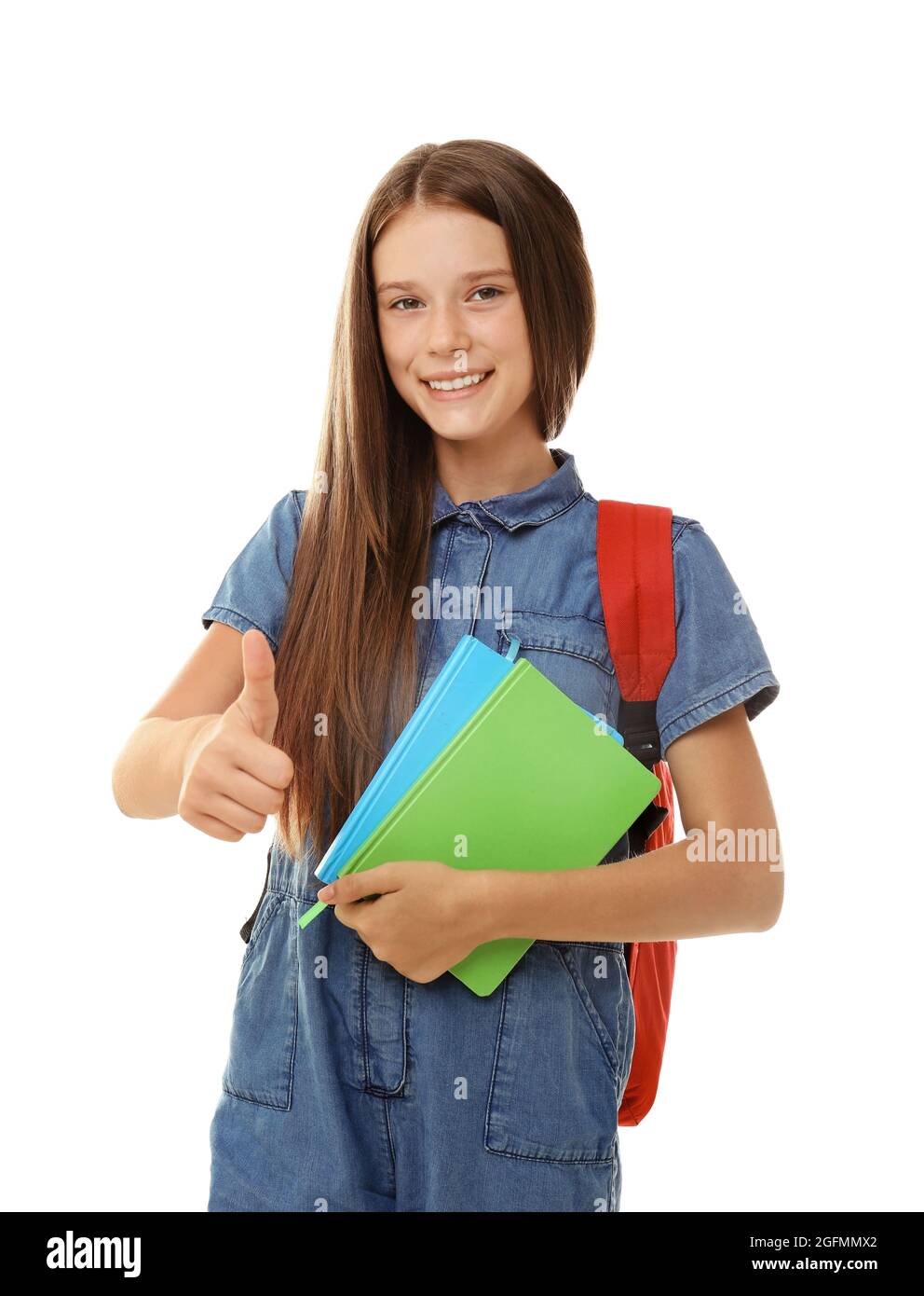 Cute teenager girl holding notebooks on white background Stock Photo ...