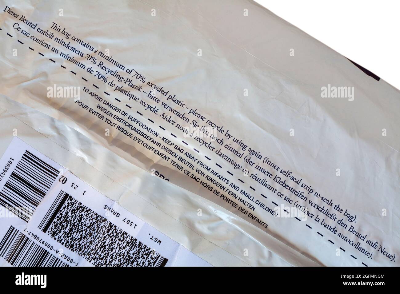 This bag contains a minimum of 70% recycled plastic - please recycle by using again (inner self-seal strip reseals the bag) - detail on plastic bag Stock Photo