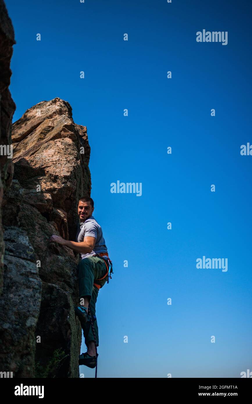 The climber makes an ascent to the top of the mountain Stock Photo - Alamy