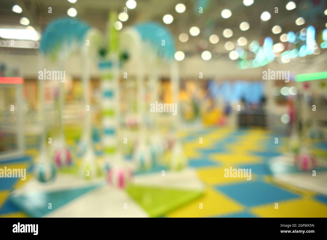 Game zone in shopping mall, blurred background Stock Photo - Alamy