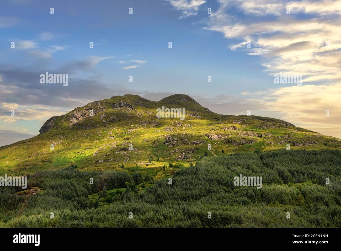 Sun starting to set on the rural Scottish Highlands in Scotland Stock Photo