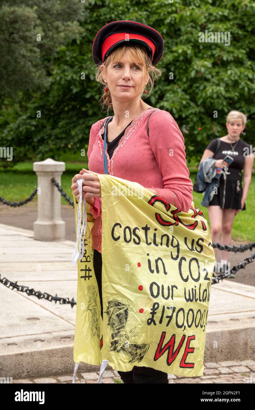 A protester holds a banner during the protest.Extinction Rebellion's Impossible Rebellion protest continues as protesters march from Hyde Park in London under the theme 'Stop The Harm' against climate change, global warming, and plans to target the root cause of the climate and ecological crisis and to demand the government divest from fossil fuel companies. (Photo by Dave Rushen / SOPA Images/Sipa USA) Stock Photo