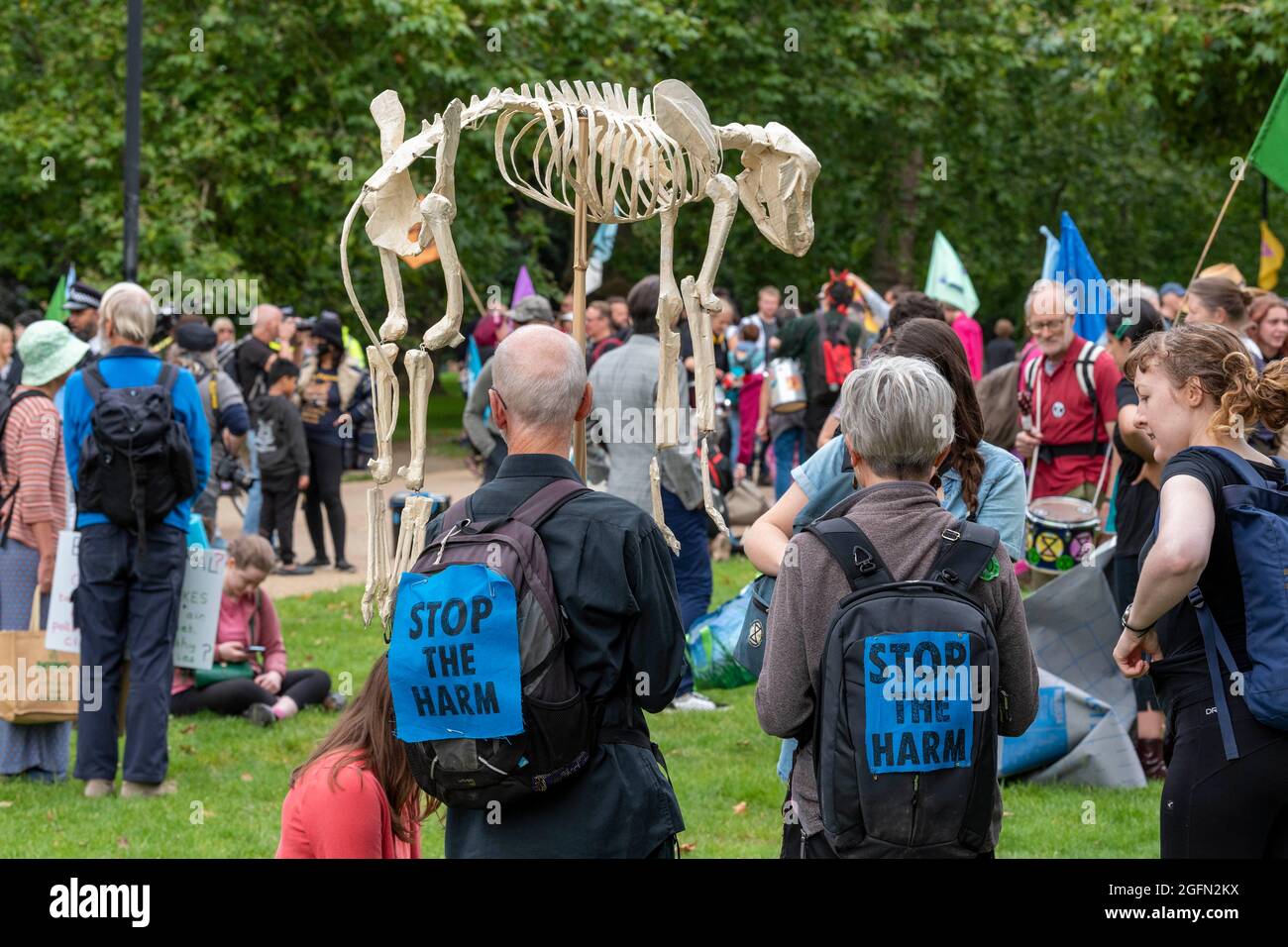 A protester carries an animal skeleton during the protest.Extinction Rebellion's Impossible Rebellion protest continues as protesters march from Hyde Park in London under the theme 'Stop The Harm' against climate change, global warming, and plans to target the root cause of the climate and ecological crisis and to demand the government divest from fossil fuel companies. (Photo by Dave Rushen / SOPA Images/Sipa USA) Stock Photo