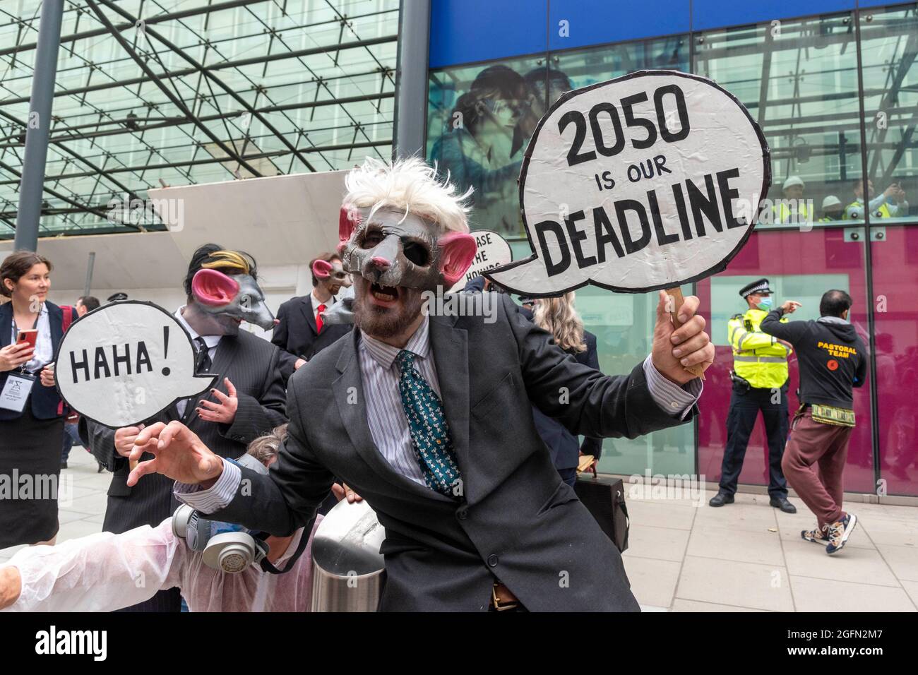 A protester in a mask outside the Department for Business Energy and Industrial Strategy during Extinction Rebellion's Impossible Rebellion protest continues march to the Department for Business Energy and Industrial Strategy under the banner of Stop The Harm protesting against climate change, global warming, and plans to target the root cause of the climate and ecological crisis and to demand the government divest from fossil fuel companies. (Photo by Dave Rushen / SOPA Images/Sipa USA) Stock Photo