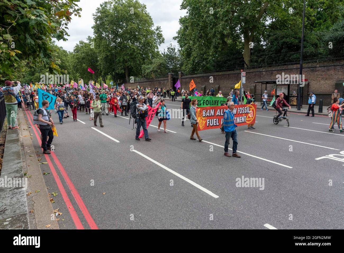Extinction Rebellion's Impossible Rebellion protest passes Buckingham Palace as they march to the Department for Business Energy and Industrial Strategy under the banner of Stop The Harm protesting against climate change, global warming, and plans to target the root cause of the climate and ecological crisis and to demand the government divest from fossil fuel companies. (Photo by Dave Rushen / SOPA Images/Sipa USA) Stock Photo