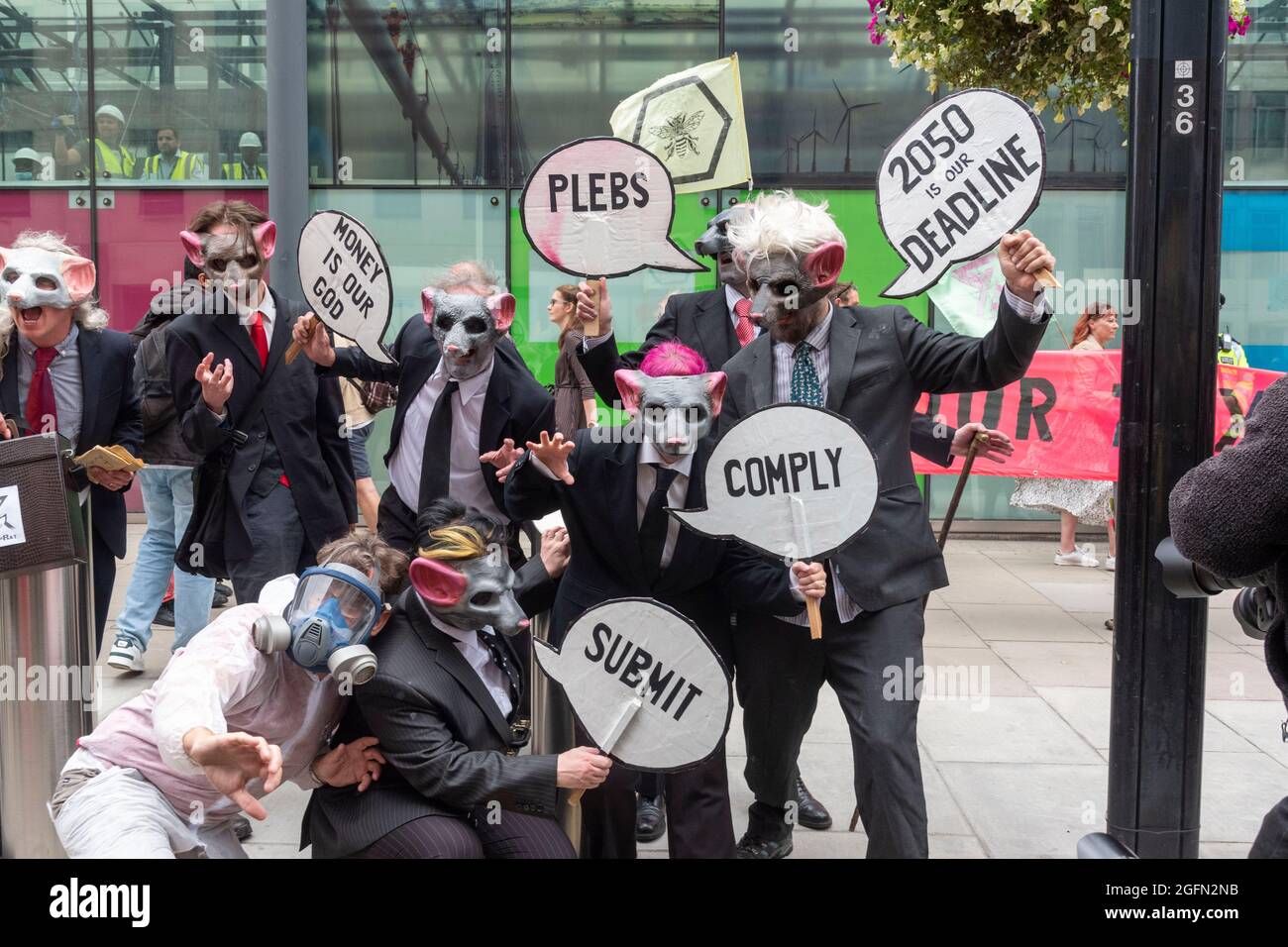 Protesters in a mask outside the Department for Business Energy and Industrial Strategy during Extinction Rebellion's Impossible Rebellion protest continues march to the Department for Business Energy and Industrial Strategy under the banner of Stop The Harm protesting against climate change, global warming, and plans to target the root cause of the climate and ecological crisis and to demand the government divest from fossil fuel companies. (Photo by Dave Rushen / SOPA Images/Sipa USA) Stock Photo