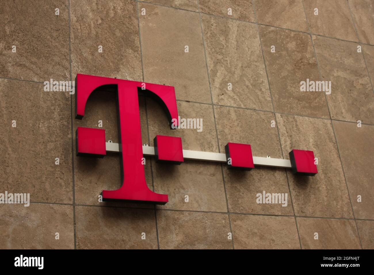 HAGUE, NETHERLANDS - JULY 23, 2021: T-Mobile sign in Hague, Netherlands. It is subsidiary of the German telecommunications company Deutsche Telekom AG Stock Photo