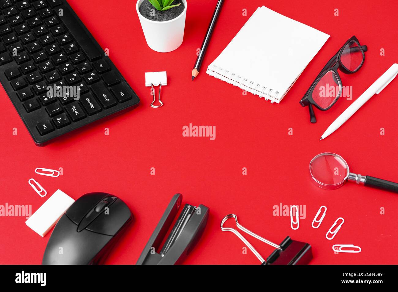 Set of stationery items on red office desk Stock Photo Alamy