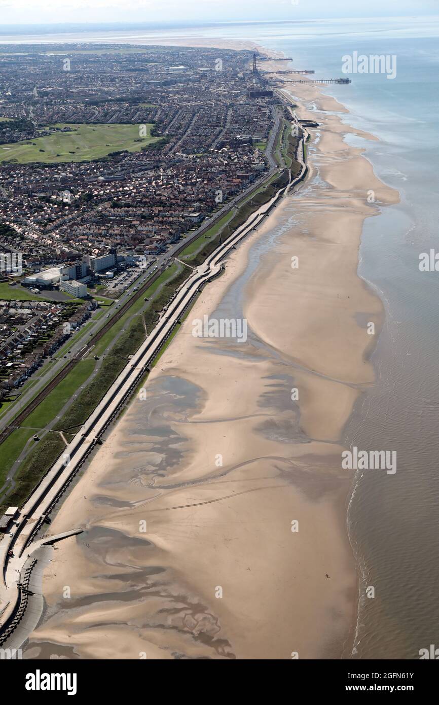 aerial view of North Shore & Bispham, Blackpool and the Golden Mile beach (with Blackpool Tower and Blackpool Piers in the far distance) Stock Photo