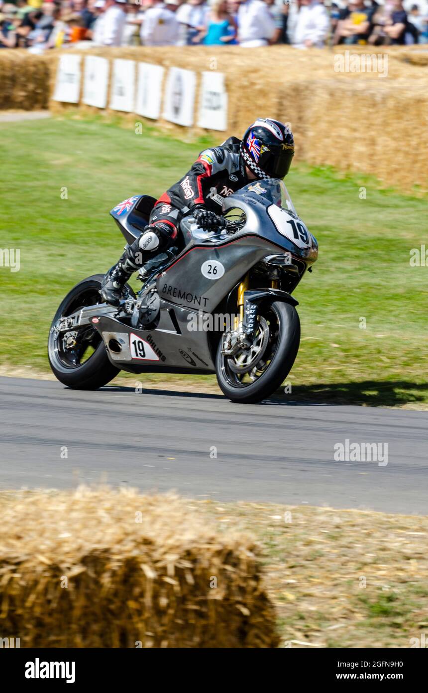 Bremont Norton SG3 motorcycle racing up the hill climb track at the Goodwood Festival of Speed motor racing event 2014. New, limited edition Stock Photo