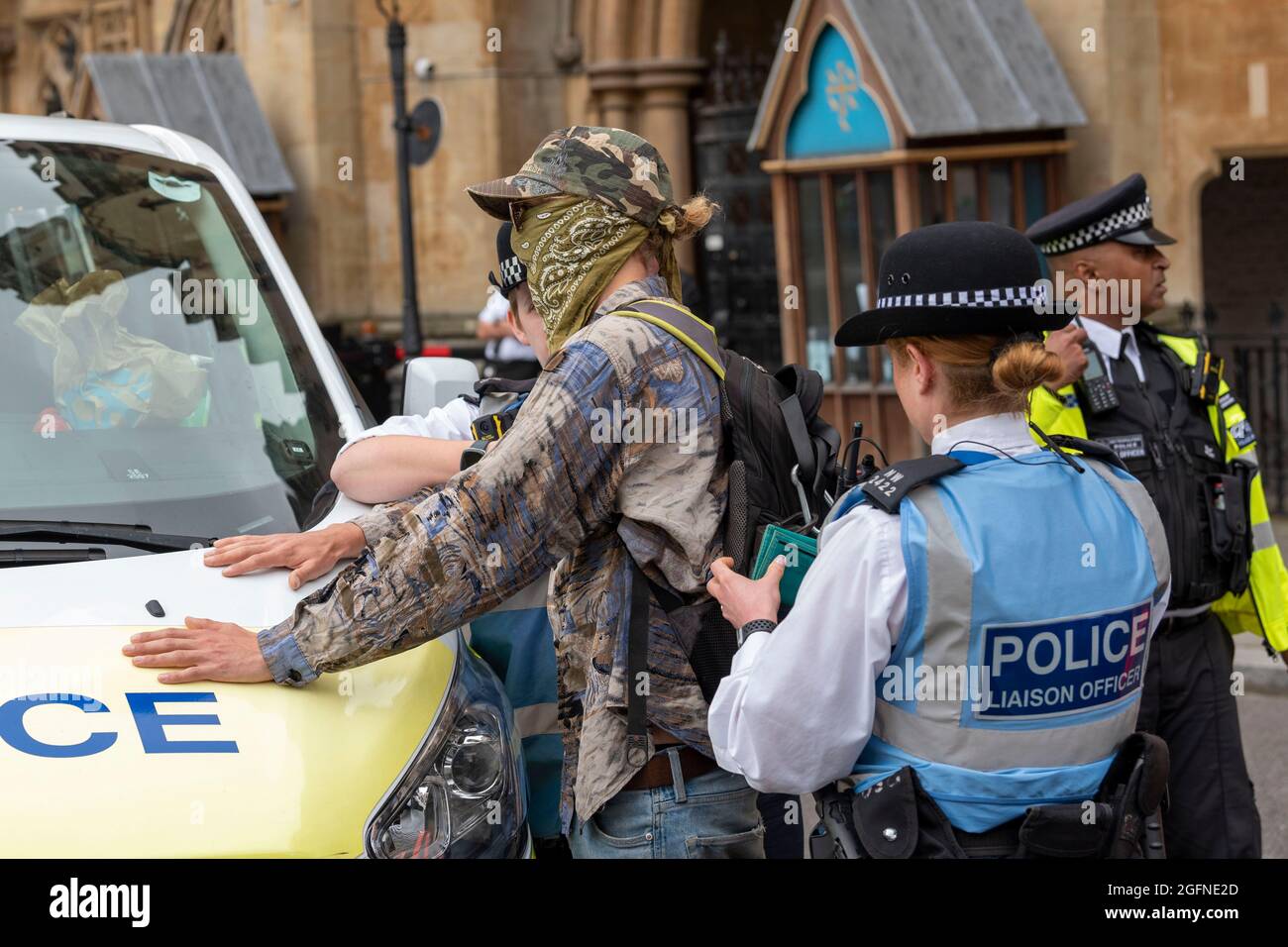 Police stop and search a male protester during the Extinction Rebellion's Impossible Rebellion protest outside the Department for Business Energy and Industrial Strategy, the man was then released. (Photo by Dave Rushen / SOPA Images/Sipa USA) Stock Photo