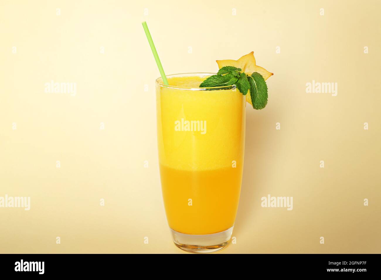 Carambola smoothie on color background Stock Photo - Alamy