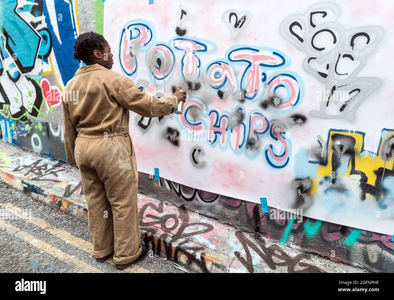 Artists Painting In The Waterloo Graffiti Tunnel London UK Stock Photo
