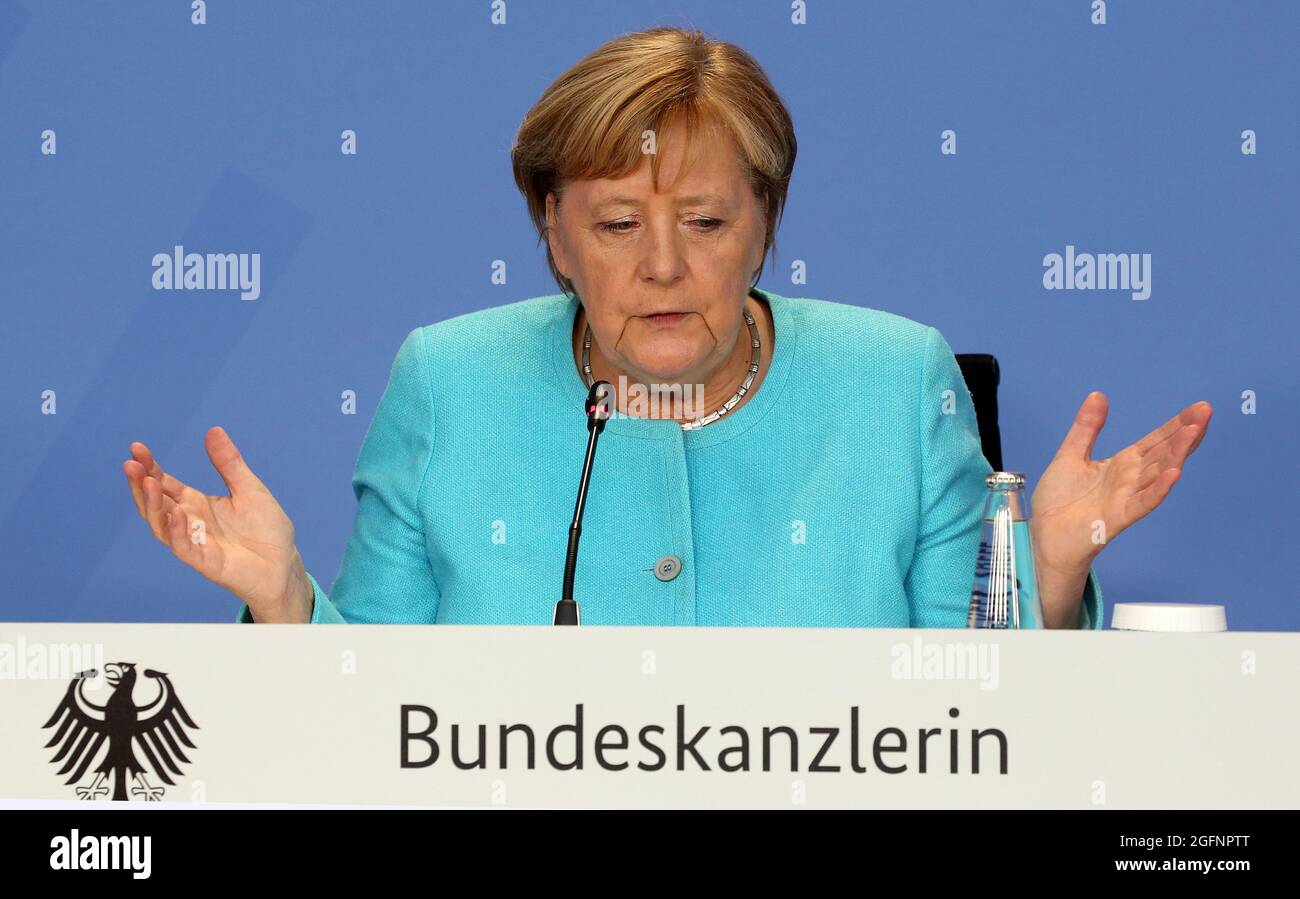 German Chancellor Angela Merkel attends a news conference after talks with directors of the ILO, IMF, OECD, World Bank and more to discuss questions on the current state of the global economic situation, in Berlin, Germany August 26, 2021. Wolfgang Kumm/Pool via REUTERS Stock Photo