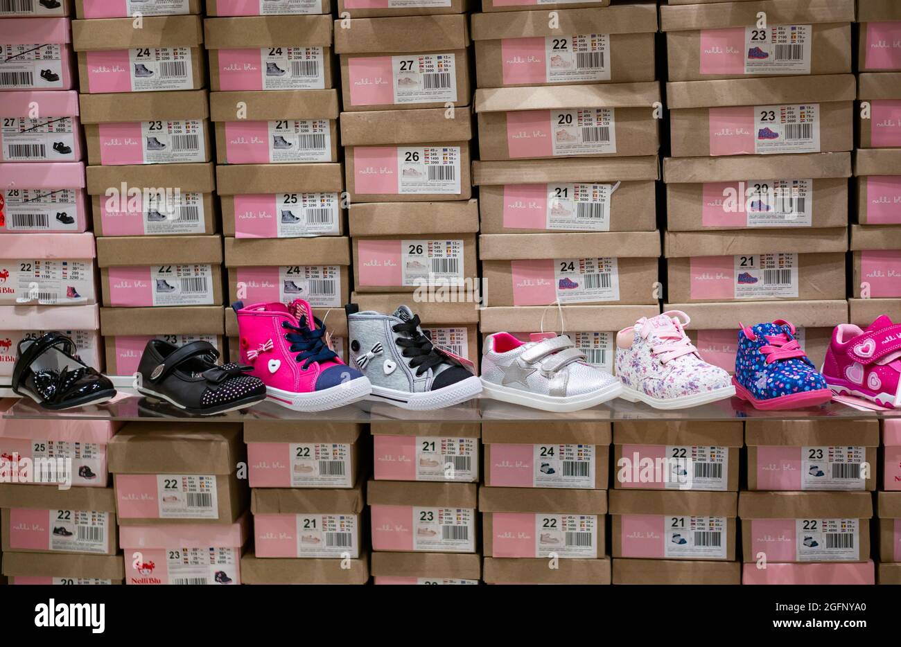 POZNAN, POLAND - Apr 20, 2018: A row of fashionable pretty small girl shoes  with boxes for sale in a store Stock Photo - Alamy