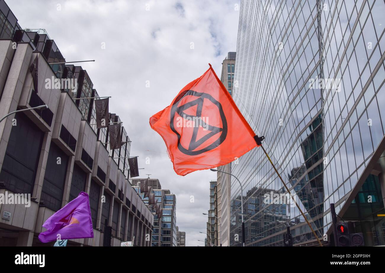 London, United Kingdom. 26th August 2021. Protesters in Victoria St. Extinction Rebellion protesters marched from Hyde Park to the Department for Business, Energy and Industrial Strategy as part of their two-week campaign, Impossible Rebellion, calling on the UK Government to act meaningfully on the climate and ecological crisis. (Credit: Vuk Valcic / Alamy Live News) Stock Photo