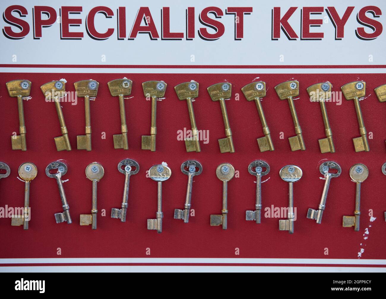 Keys attached to a board with the words specialist keys Stock Photo Alamy