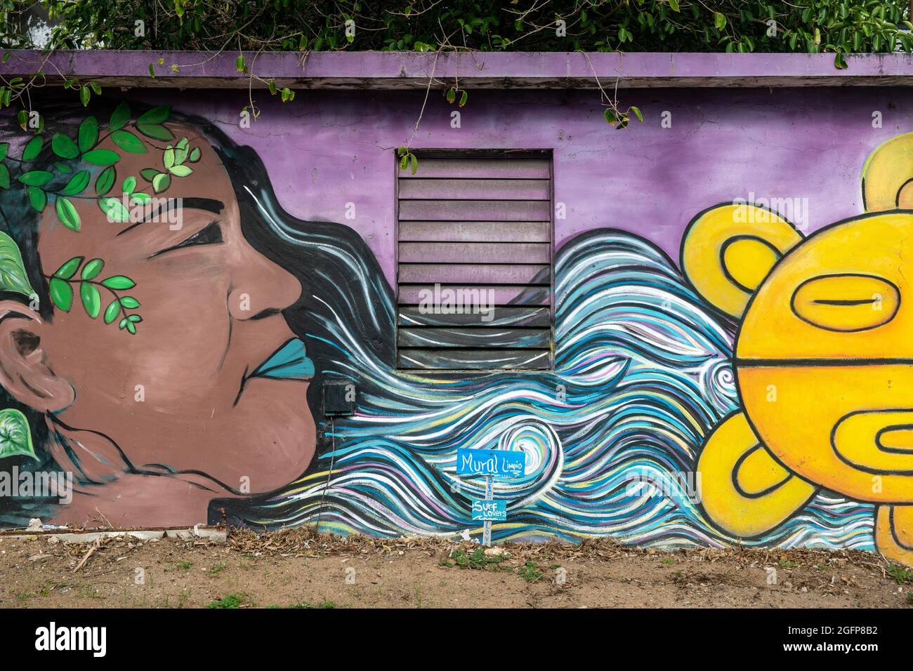 A building painted with a mural of a woman - Puerto Rico Stock Photo