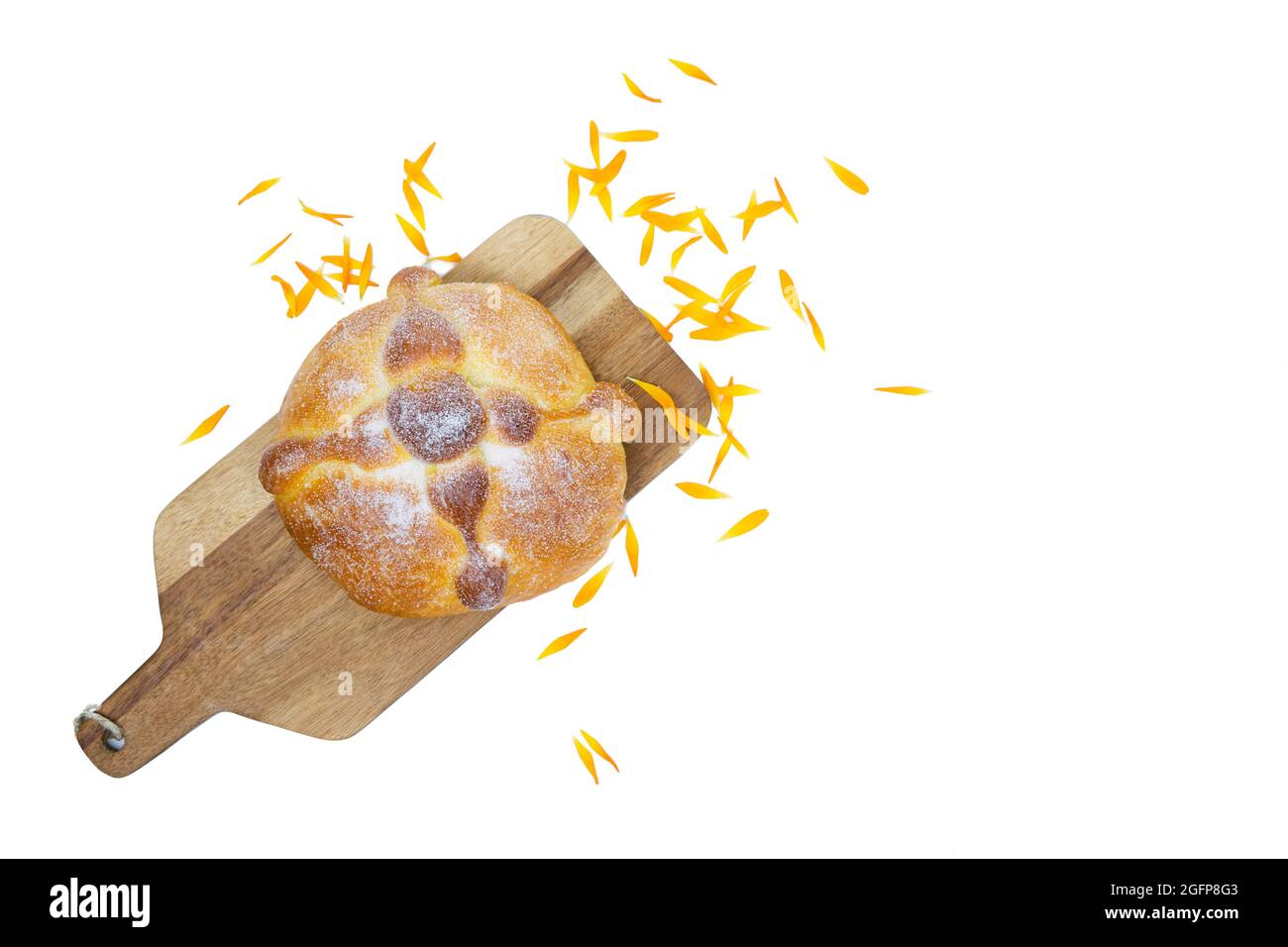 Pan de muerto on yellow background, typical mexican food. Day of the dead celebration. Copy space. Top view. Stock Photo