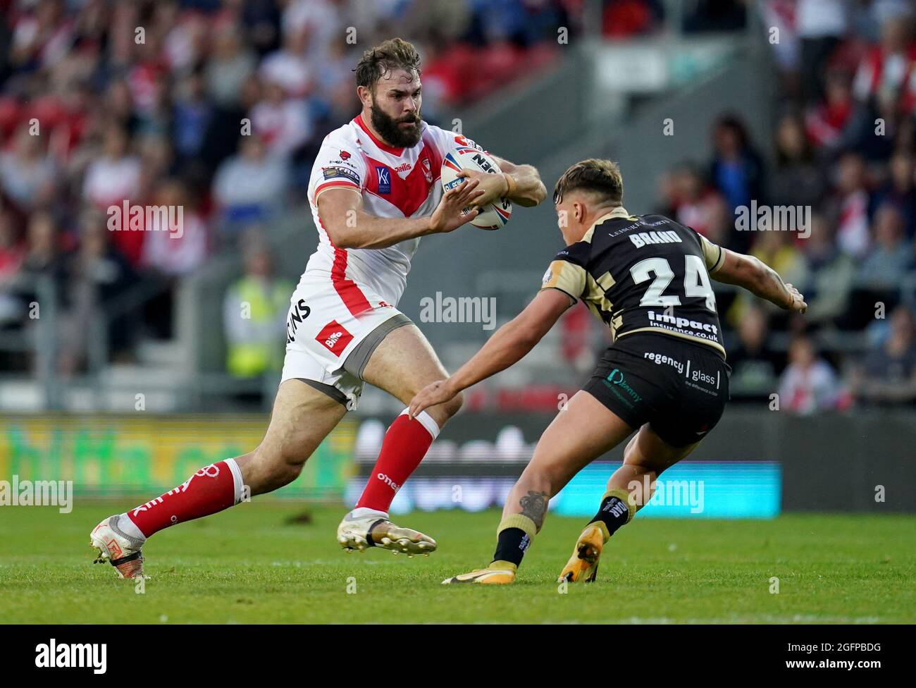 St Helens’ Alex Walmsley in action with Leigh Centurions’ Keanan Brand during the Betfred Super League match at the Totally Wicked Stadium, St. Helens. Picture date: Thursday August 26, 2021. Stock Photo