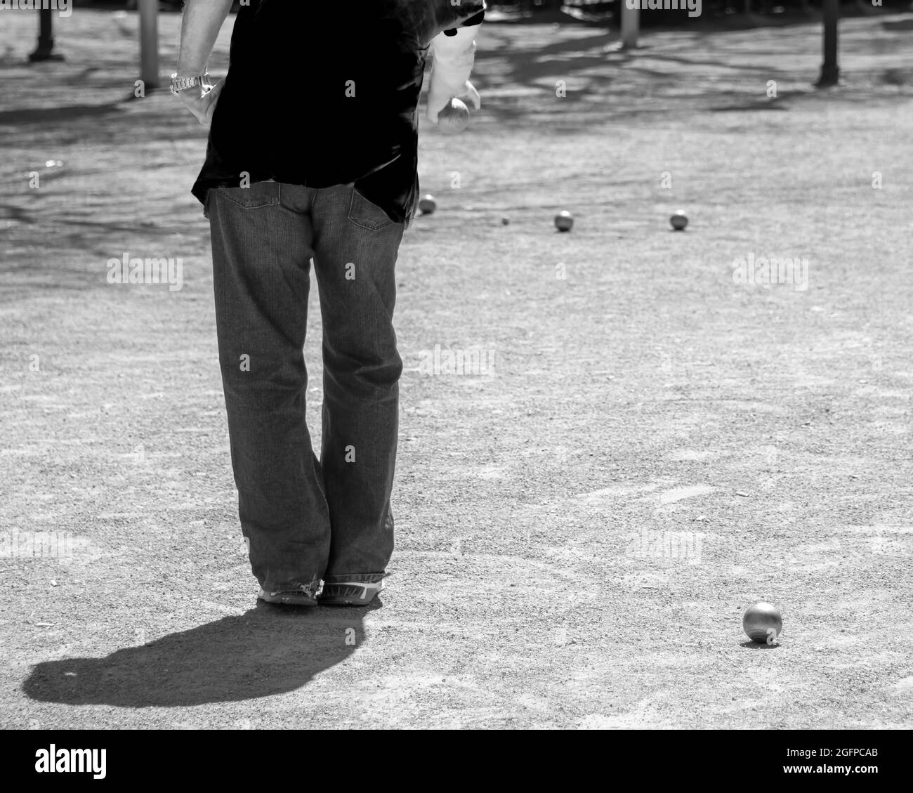 Rear view of player of bowls with friends in the leisuretime Stock Photo