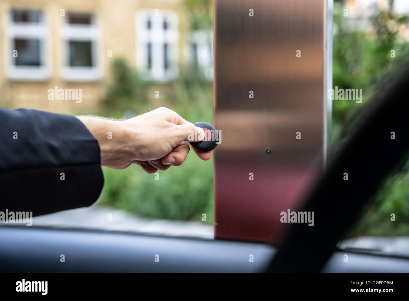 Automatic Wireless Home Garage Door. Hand Using Controller In Car Stock Photo