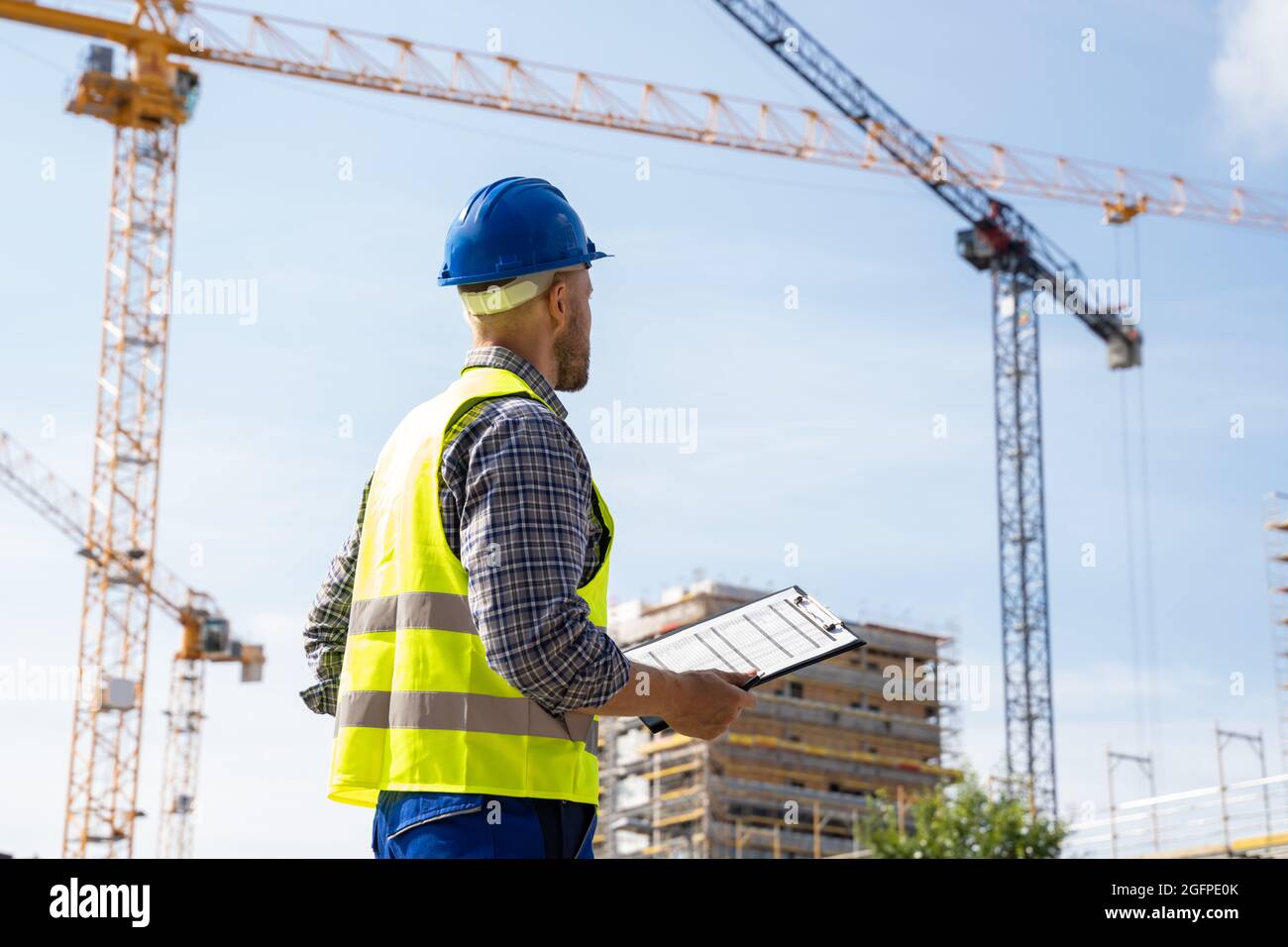 OSHA Inspector At Construction Site. Young Engineer Worker Stock Photo