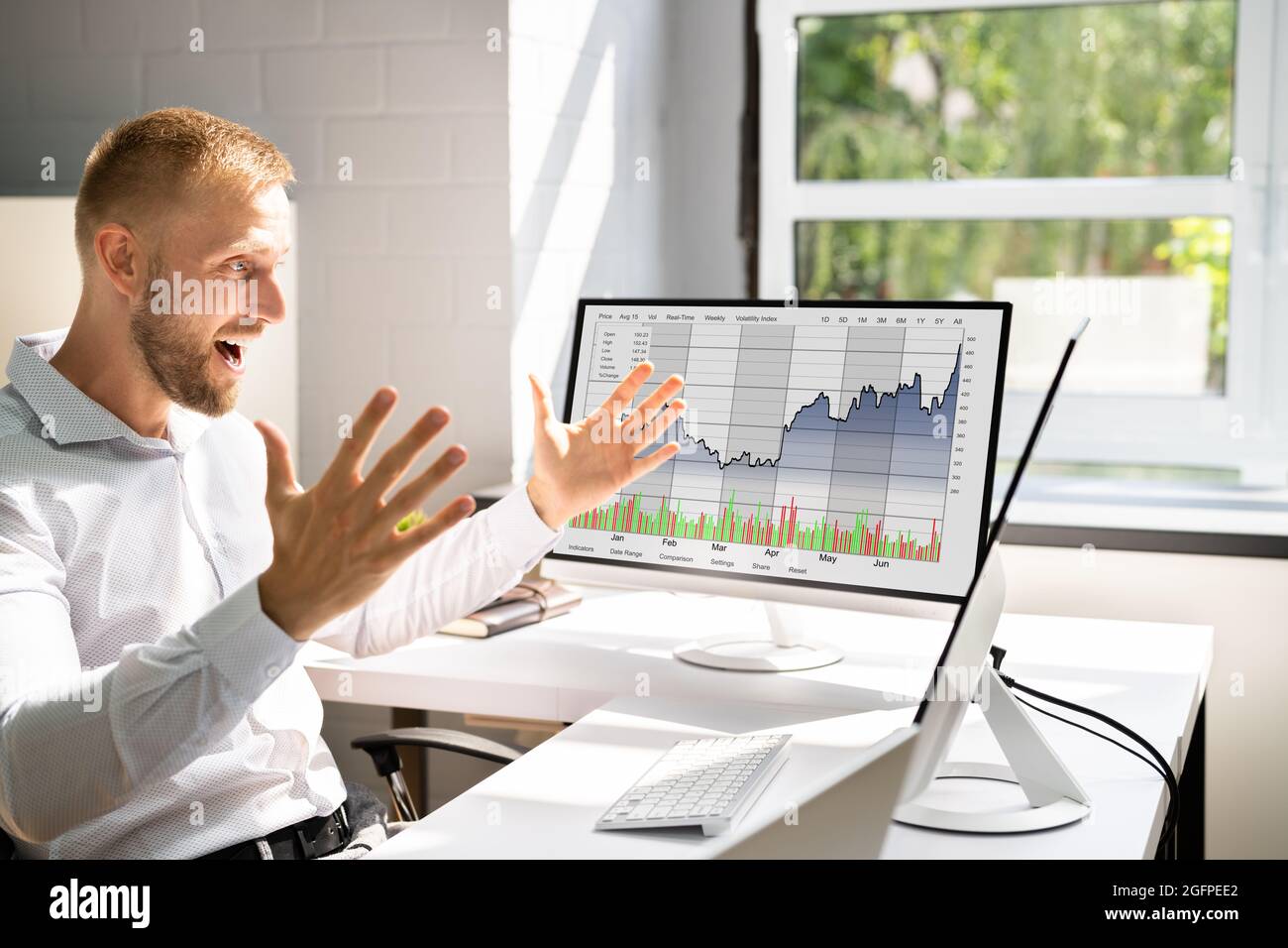 Excited Stock Market Broker Watching Screens And Trading Stock Photo
