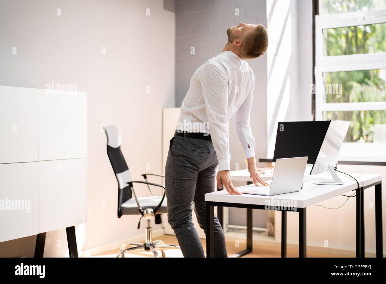 Stretching Yoga Office Workout At Business Computer Desk Stock Photo