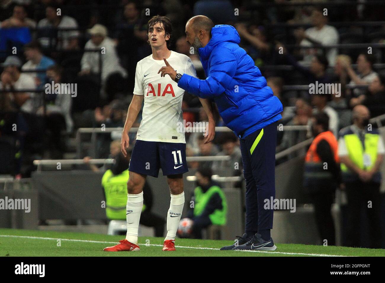 Tottenham Hotspur Head Coach Nuno Espirito Santo (R) gives instructions to Bryan Gil of Tottenham Hotspur (L). UEFA Europa conference league play off match 2nd leg, Tottenham Hotspur v Pacos de Ferreira at the Tottenham Hotspur Stadium in London on Thursday 26th August 2021. this image may only be used for Editorial purposes. Editorial use only, license required for commercial use. No use in betting, games or a single club/league/player publications. pic by Steffan Bowen/Andrew Orchard sports photography/Alamy Live news Stock Photo