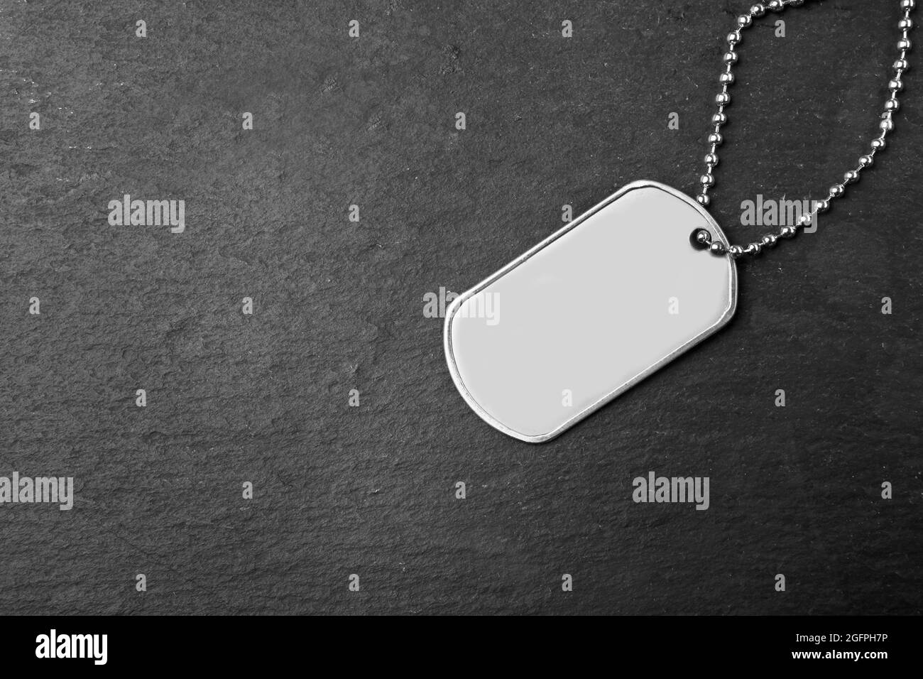 Military ID tag on dark background Stock Photo Alamy
