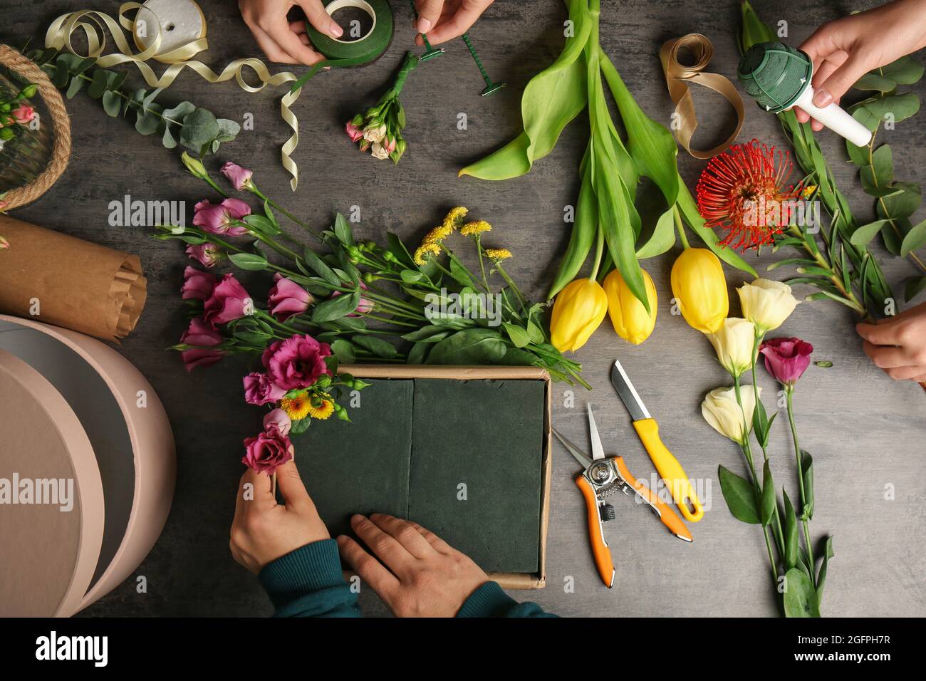 Female hands making beautiful flower composition in floral shop Stock ...