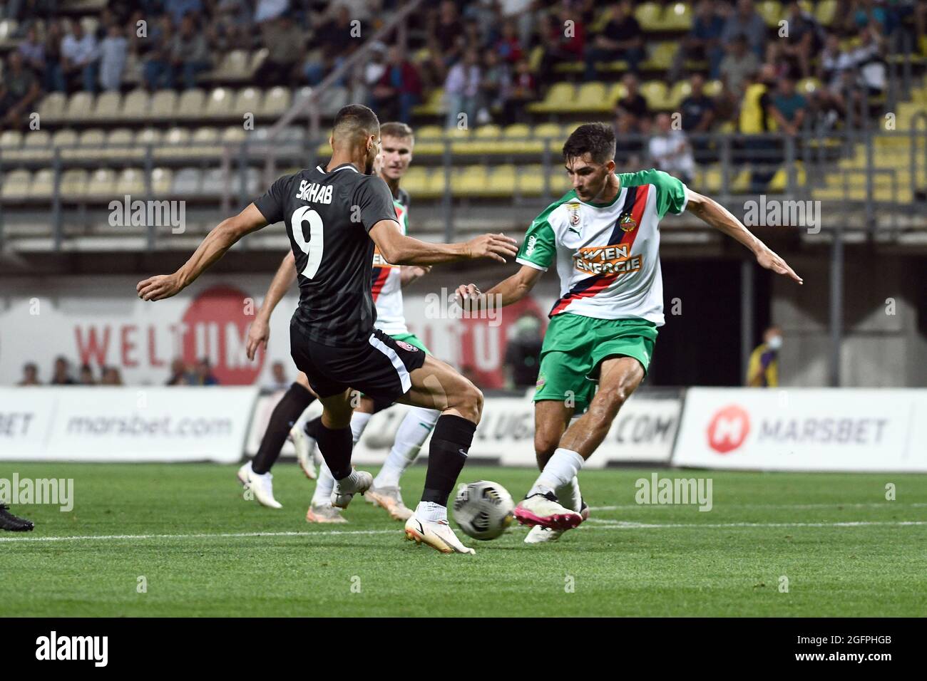 ZAPORIZHZHIA, UKRAINE - AUGUST 26, 2021 - Forward Shahab Zahedi Tabar (L) of FC Zorya Luhansk is seen in action with a player of SK Rapid Wien during the 2021/2022 UEFA Europa League play-off 2nd leg game at the Slavutych Arena, Zaporizhzhia, southeastern Ukraine. Stock Photo