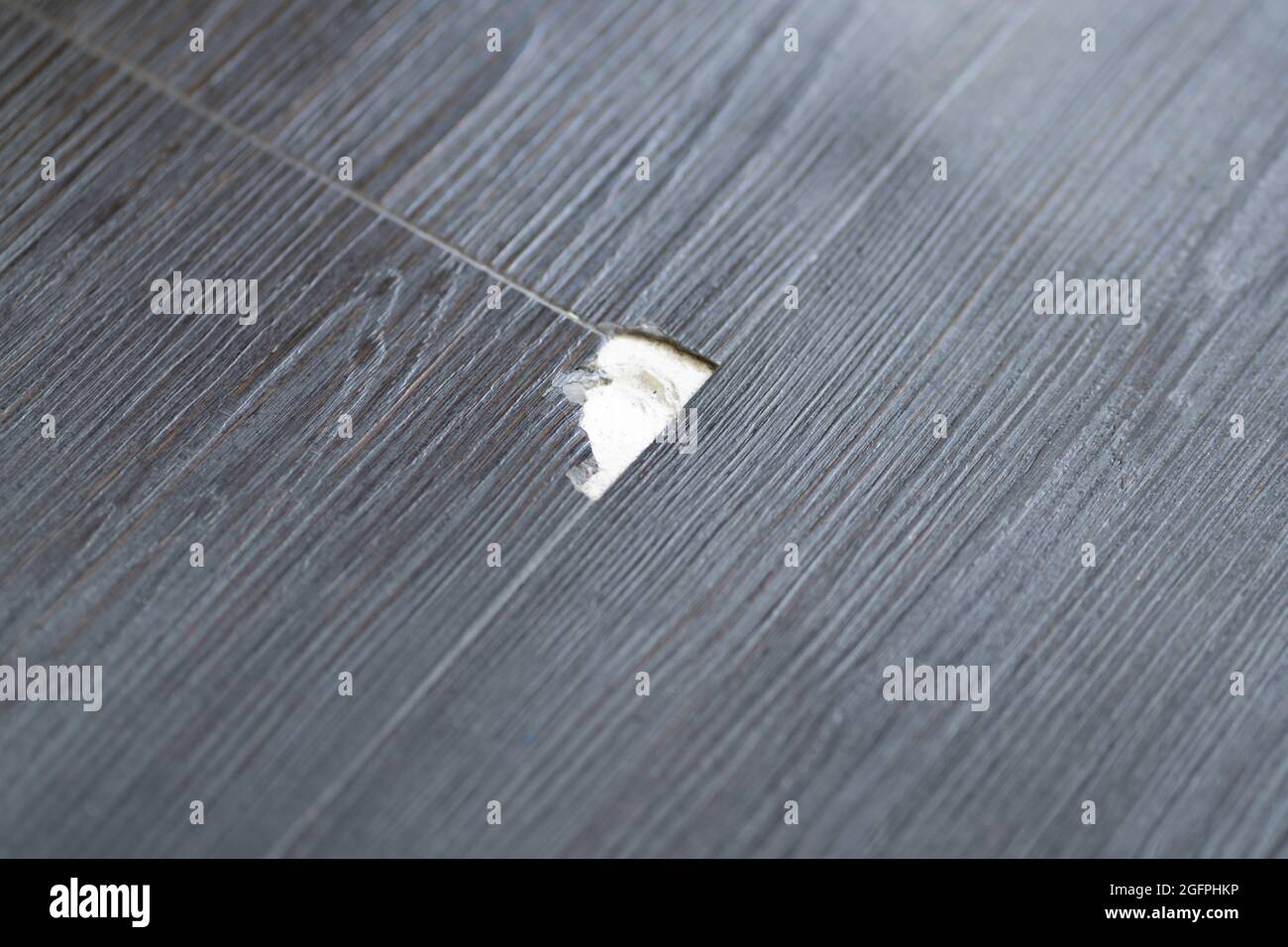 Damaged Wooden Floor. Laminate Scratch. Broken Vinyl Flooring Stock