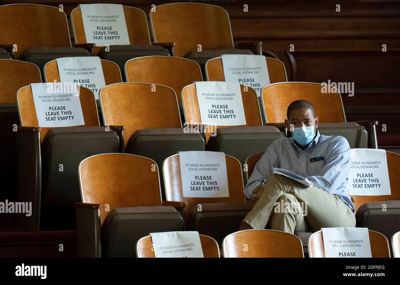 A spectator listens in the gallery as the Texas House debates SB 1, a Republican-led measure that would tighten voting procedures in Texas including a ban on 24-hour voting and mail-in ballot restrictions. Credit: Bob Daemmrich/Alamy Live News Stock Photo