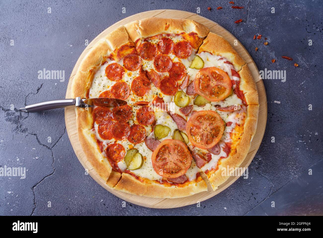 Pepperoni pizza and sausage pizza on the same board Stock Photo Alamy