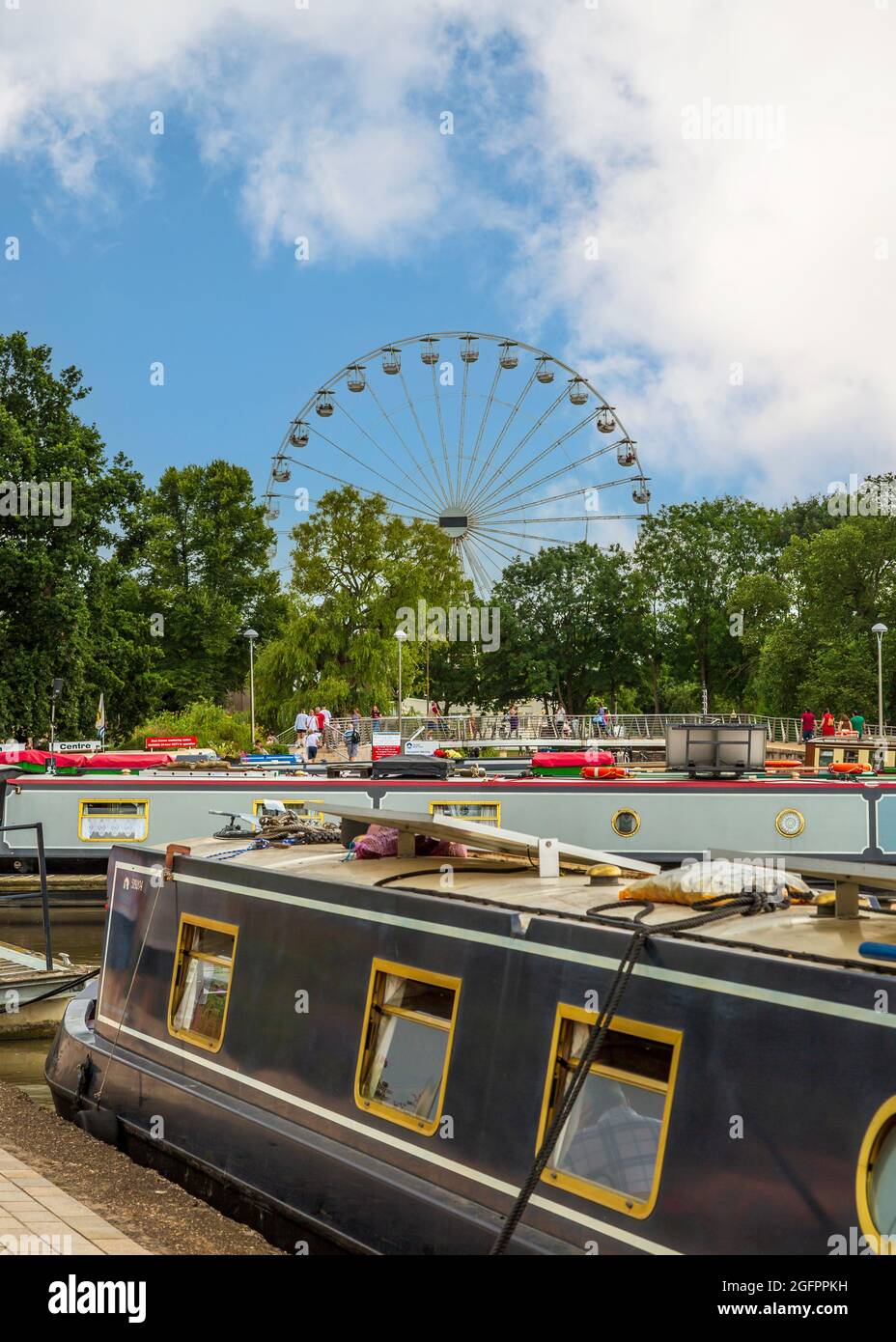 River barges with the Stratford Wheel in the distance in Stratford upon
