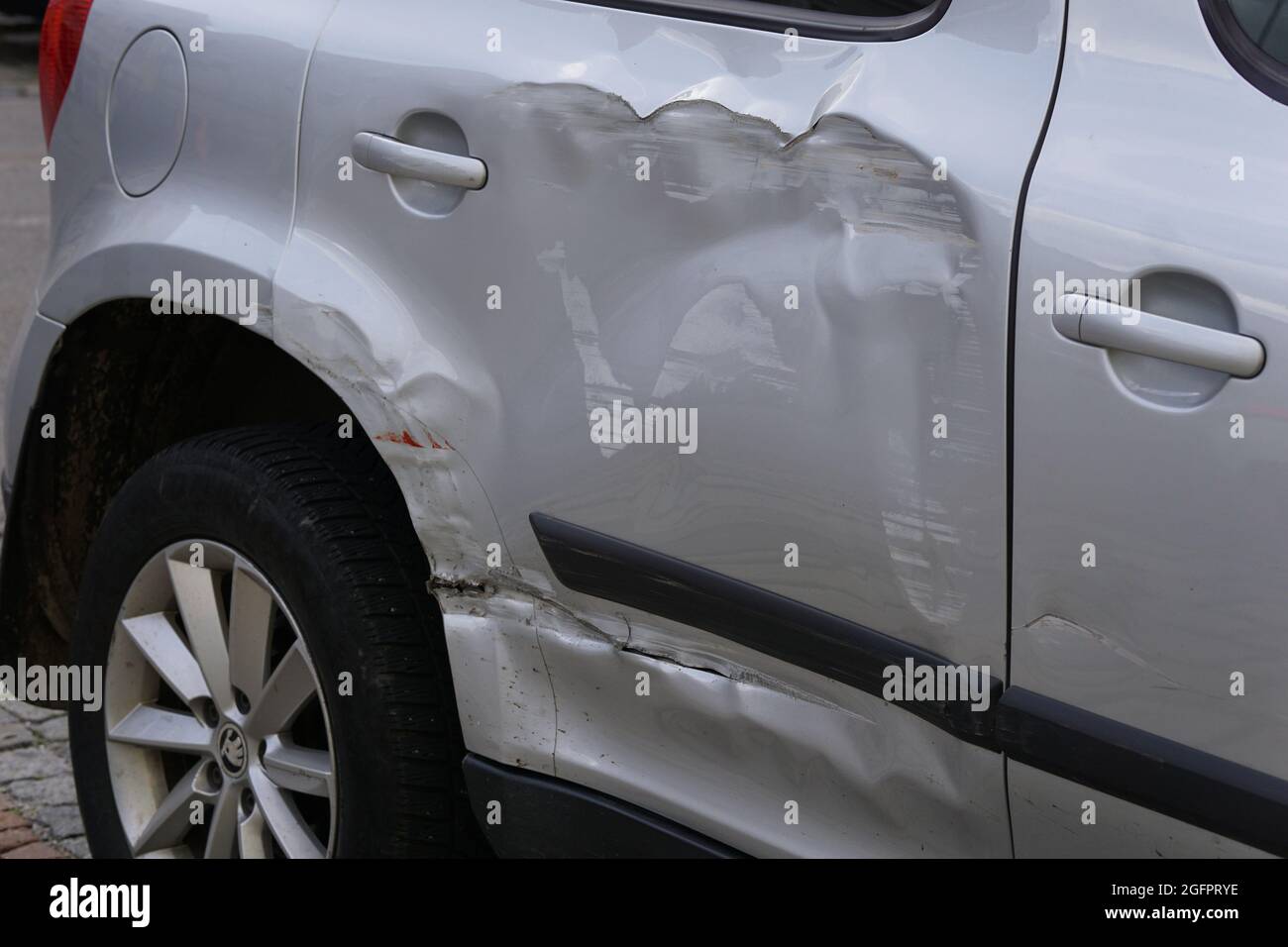 damage right rear door of a Silver car Stock Photo