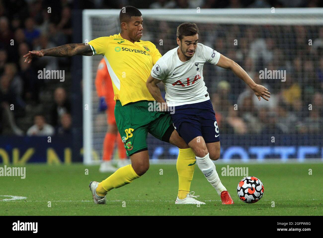 Harry Winks of Tottenham Hotspur (R) is tackled by Douglas Willian Da Silva Souza of Pacos de Ferreira (L). UEFA Europa conference league play off match 2nd leg, Tottenham Hotspur v Pacos de Ferreira at the Tottenham Hotspur Stadium in London on Thursday 26th August 2021. this image may only be used for Editorial purposes. Editorial use only, license required for commercial use. No use in betting, games or a single club/league/player publications. pic by Steffan Bowen/Andrew Orchard sports photography/Alamy Live news Stock Photo